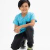 Kid boys henley T-shirt in cotton single jersey fabric. Rounded scoop neckline with front button fastening and short sleeves. All-over playfull prints with a chest pocket.