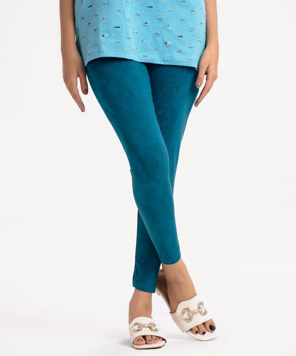 Teen girl's all-over printed leggings in cotton knit fabric. Concealed elasticated waistline.