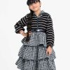 Kids girls layered jacket in houndstooth tweed fabric. Classic collar and long puff sleeved. front opening zipper with an adjustable belt.