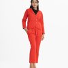 Printed blazer pant style top-bottom set in french terry fabric. Shawl neck, full-sleeved top with formal pants as the bottom.