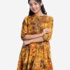 Teen girl's frock style tunic in printed georgette fabric. Stand collar and three-quarter sleeves. Patch at placket, sleeves cuff and hem.