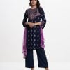 Women's printed straight salwar kameez in textured georgette fabric. Round neck, karchupi at the front and full sleeves. Crepe silk palazzo and chiffon dopatta.