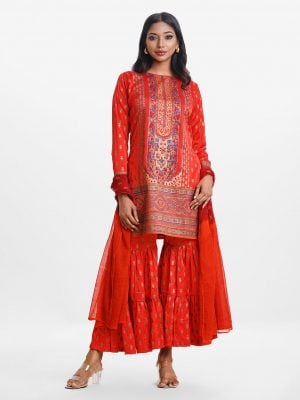Printed straight salwar kameez in crepe fabric. Round neck, full sleeves and karchupi at front. Chiffon dupatta with sharara pajamas.