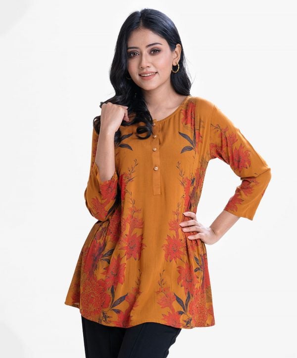 Women's A-line tunic in viscose fabric. U-neck with metal buttons placket, three quarter sleeves.