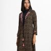 Printed A-line shrug in georgette fabric. Lapel collar with embroidery, front opening with tassel tie and long sleeved.