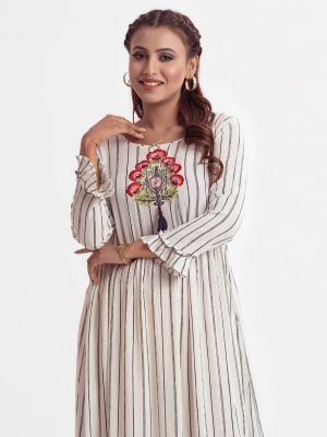 Women's stripe printed frock style tunic in cotton fabric. Boat neck, three-quarter sleeves. Embroidery with tassel tie at front.
