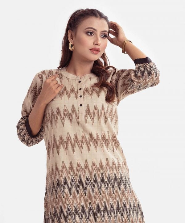Chevron printed A-line tunic in cotton jacquard fabric. Stand Collar, bishop Sleeved and button fastening at the front.