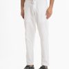 Men's pant pajama in blended cotton fabric. Two zippers fly side pockets with adjustable knots and two back pockets.