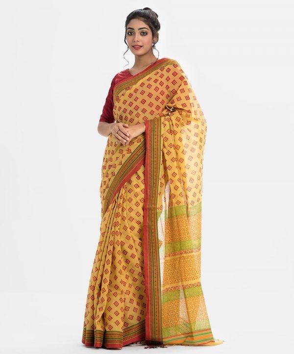 All-over printed saree in cotton fabric. Fringe trim at the border of anchal.