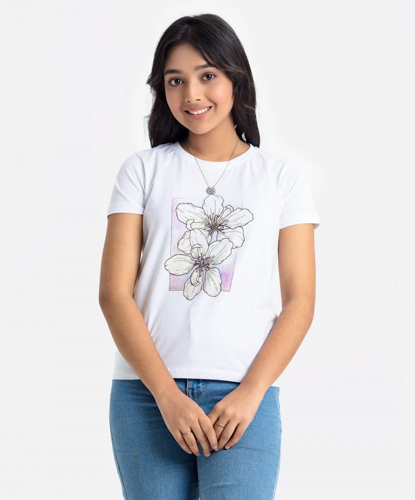 Teen girl's t-shirt in cotton knit fabric. Round neck, short sleeves. Floral print on the chest.