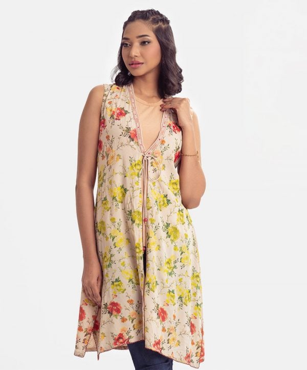 Women's floral printed long shrug in viscose fabric. Open front with tassel tie-cord, sleeveless and embroidery at front.