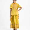 Kid girls printed ghagra choli set in viscose fabric. Butterfly-sleeved top with karchupi at front. Tie-dye chiffon dupatta with a printed skirt.
