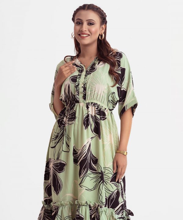 Women's flared style maxi in printed georgette fabric. V-neck with frill placket and kimono sleeves.