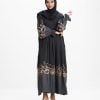 Women's gown style abaya in crepe fabric. Round neck, bishop sleeves. Box pleated waistline. Karchupi and print detail at sleeves and hemline.