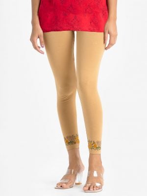 Women's leggings in stretchable cotton knit fabric. Concealed elasticated waistline and floral print at hemline.