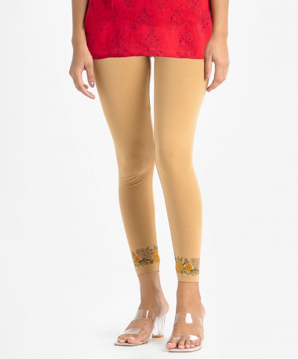 Women's leggings in stretchable cotton knit fabric. Concealed elasticated waistline and floral print at hemline.