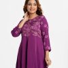 Printed A-line tunic in crepe fabric. Round neck, three-quarter sleeved. Karchupi at the front and gathered at hemline.