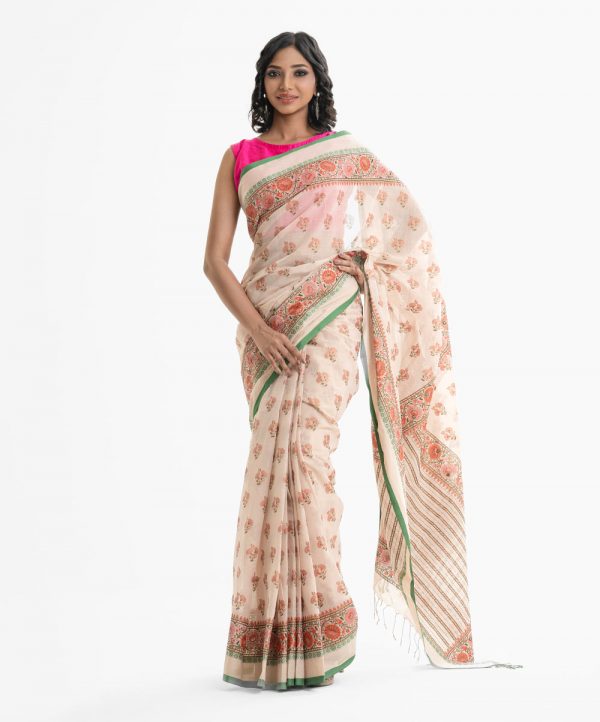 Women's all over printed saree in cotton fabric. Embellished with embroidery and fringe trim at the achal.
