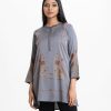 Women's floral printed A-line tunic in crepe fabric. Line stitching at stand collar and placket, full sleeves.