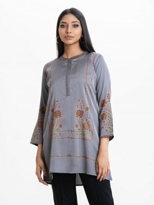 Women's floral printed A-line tunic in crepe fabric. Line stitching at stand collar and placket, full sleeves.