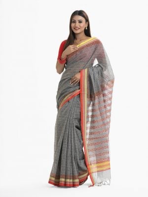 Women's all over printed saree in cotton fabric. Fringe trim at the achal.
