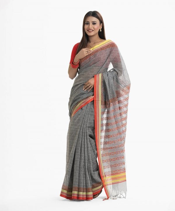 Women's all over printed saree in cotton fabric. Fringe trim at the achal.