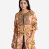 Printed A-line tunic with shrug in satin fabric. Stand collar with lantern sleeves. Karchupi at the front. Gathered at the waistline with a tassel tie.