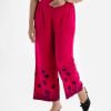 Women's casual style palazzo in viscose fabric. Concealed elasticated waistline and floral print at hemline.