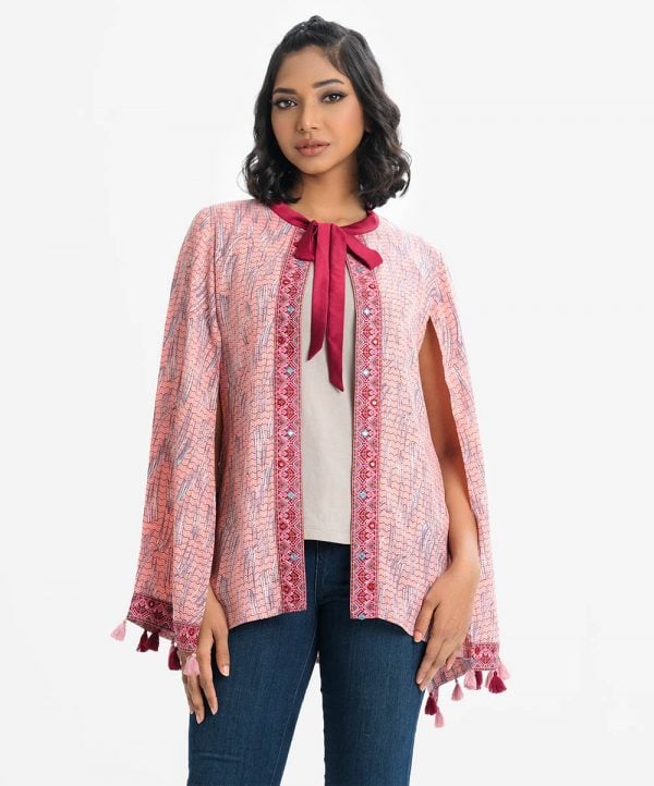 Women's abaya style cape in printed georgette fabric. Round neck with bow tie, full slit sleeves with tassels. Patch with karchupi at front.