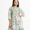 Printed A-line tunic in blended cotton fabric. V-neck, three-quarter sleeved. gathered at the waistline, attached patch at the front and hemline.