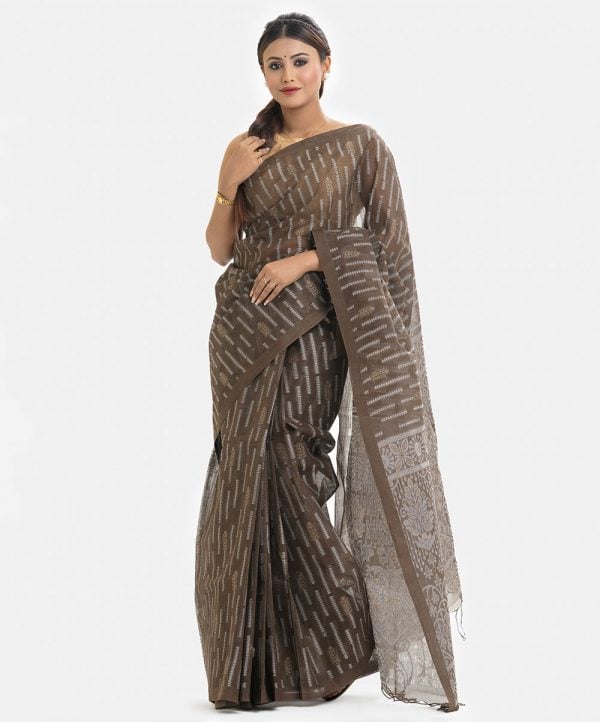 Women's traditional saree in cotton fabric. Embellished with weaving details and fringe trim at the achal.