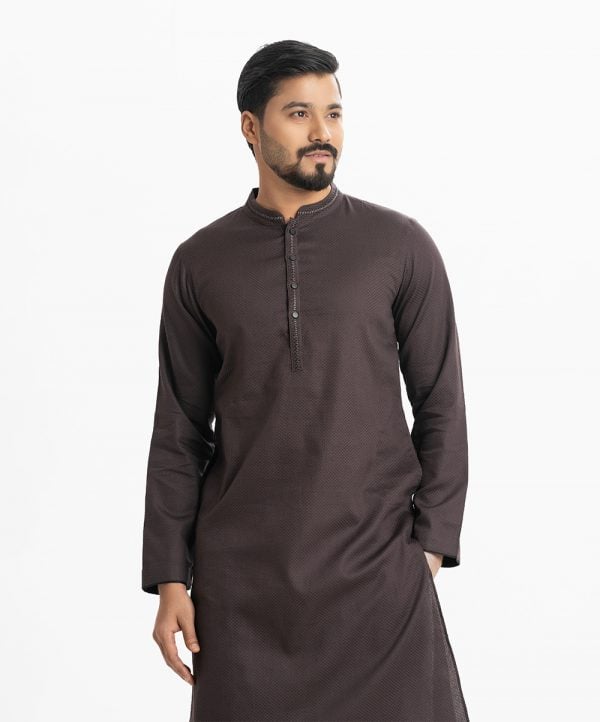 Mens semi-fitted panjabi in jacquard fabric. Mandarin collar, inseam pockets. Embroidery at the collar and placket. Button Fastening at the front.