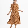 Women's skirt top set in printed georgette fabric. Shirt style top with roll-up sleeves. Concealed elasticated waist with side hidden zipper skirt.
