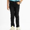 Kid boys pant in denim fabric. Five pockets and a zipper fly with a metal button.