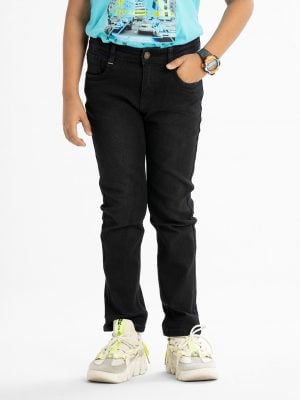 Kid boys pant in denim fabric. Five pockets and a zipper fly with a metal button.