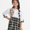 Kid girls A-line tunic in half-body in viscose and below half in georgette fabric. Three-quarter roll-up sleeves and classic collar with buttons placket.
