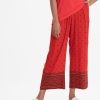 Women's palazzo in viscose fabric. Allover printed. Concealed elasticated waistline.