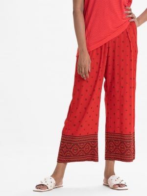 Women's palazzo in viscose fabric. Allover printed. Concealed elasticated waistline.