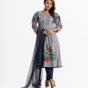 Floral printed A-line salwar kameez from Nargisus by Le Reve in georgette fabric. Round neck with frill, bishop-sleeved. Box pleated at the waistline. Embroidery and karchupi at the sleeve and hem. complemented Muslin dupatta with patch and tassel tie. Crepe culotte pant.