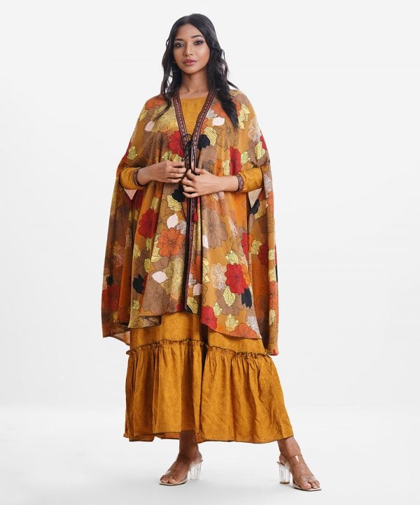Women's gown style abaya upper part in printed georgette fabric with patchwork front opening in tassel ties. And flared gown in viscose fabric with three-quarter sleeves.