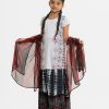 Kid girls ghagra choli in viscose fabric. Round neck, short--sleeve, and karchupi at the top front. Completed with tie-dye A-line skirt with patch at the hemline and tie-dye dupatta.