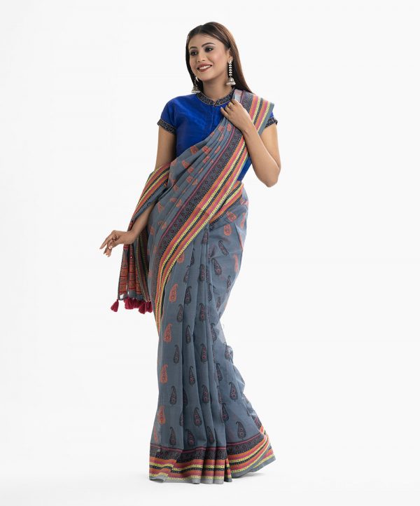 Women's all over printed saree in cotton fabric. Embellished with embroidery and tassel at the achal.