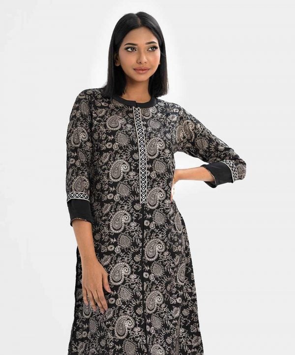 Printed A-line kameez in crepe fabric. Stand collar, three-quarter sleeved and karchupi at the button placket.