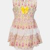 Sleeveless tent-style newborn baby girls frock in cotton fabric. All-over floral printed with lace work at hemline and attached ribbon bow. Completed with baby pants.