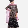 Kid girl's floral printed ghagra style salwar kameez in georgette fabric. Round neck, three-quarter sleeves and karchupi at front of kameez. Net dupatta with ghagra style salwar.