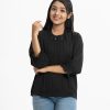 Teen girl's top in georgette fabric. Mock neck, long puff sleeved. Stone and pin-tuck at the front.