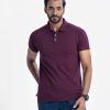 Men's slim fitted short-sleeved polo shirt in cotton pique fabric. Rib collar and button-up front.