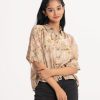 Teen girl's floral printed shirt style woven tops in blended cotton fabric. Classic collar and kimono sleeves.