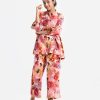 Teen girls A-line top bottom set in printed georgette fabric. Classic collar, balloon sleeve and frill trim at both side waistline of tops. Palazzo pants with inseam pockets as the bottom.
