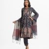 Printed A-line salwar kameez in crepe fabric. Round neck, three-quarter sleeved. Karchupi and embroidery at the front. Culotte pant and half silk dupatta.
